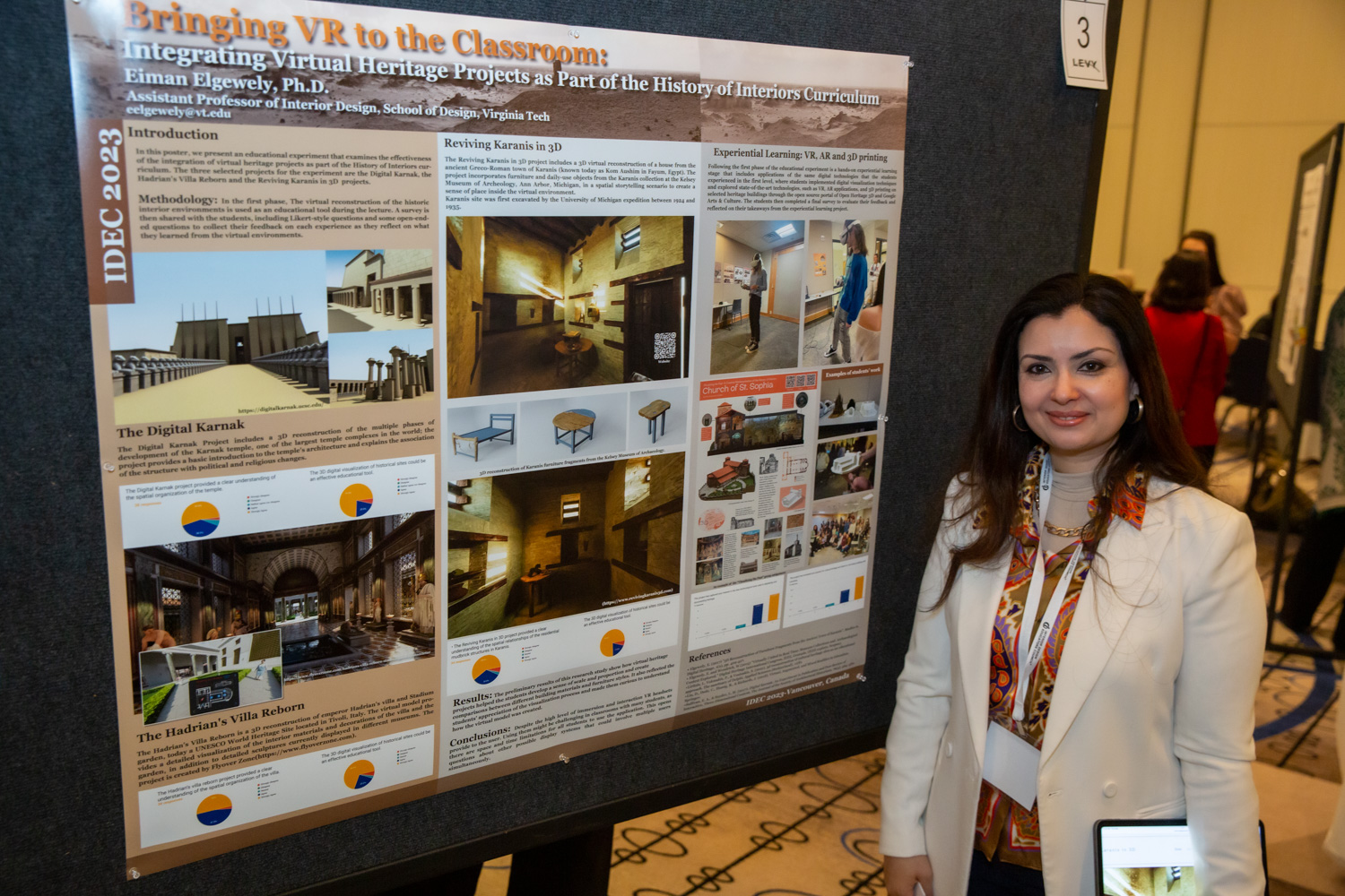 Eiman Mohamed Elgewely standing next to poster titled "Bringing VR to the Classroom"